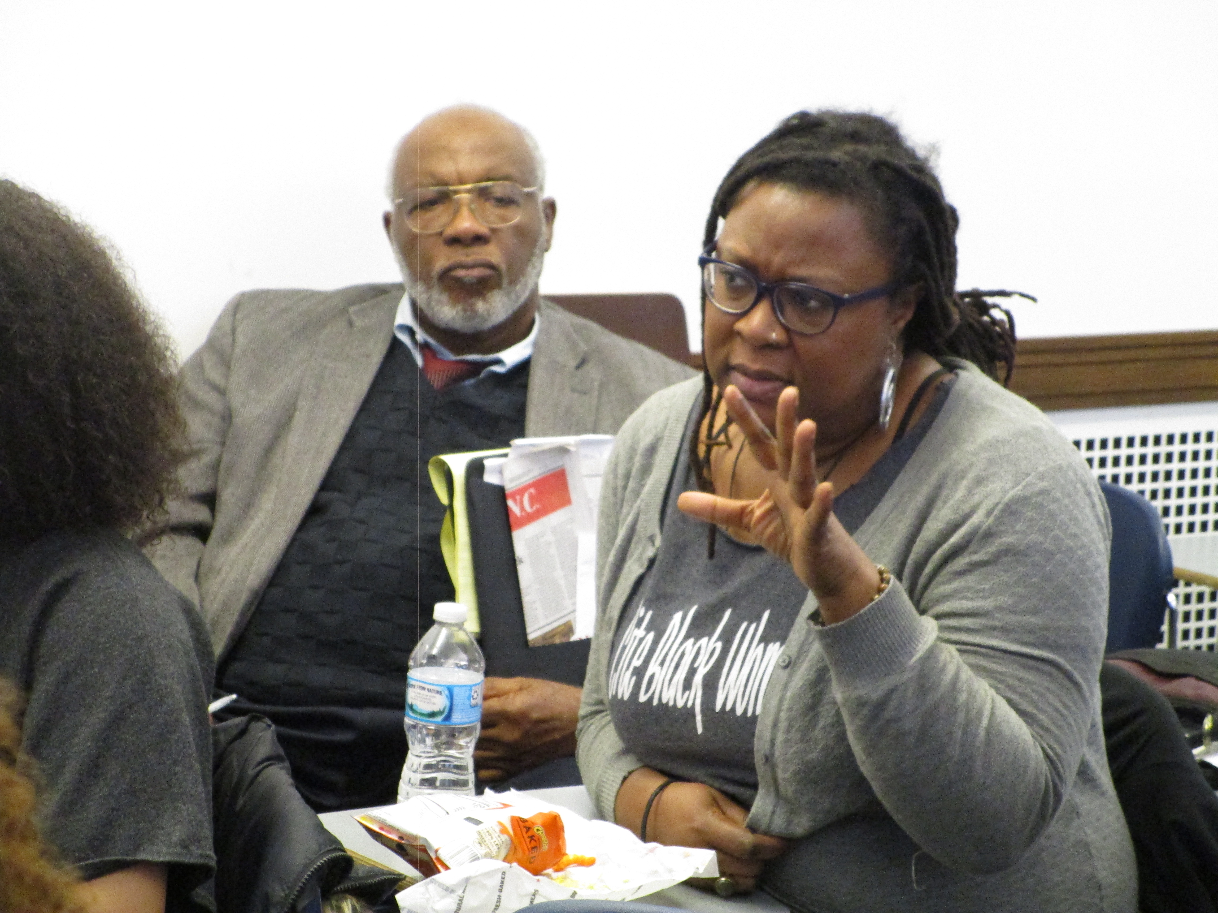 Drs. Krystal Smalls and Bailey asking a question during the seminar Q & A portion